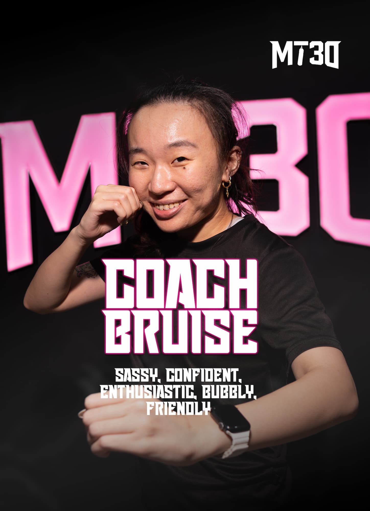 Bruise, MT30 trainer, smiling in front of the MT30 wall