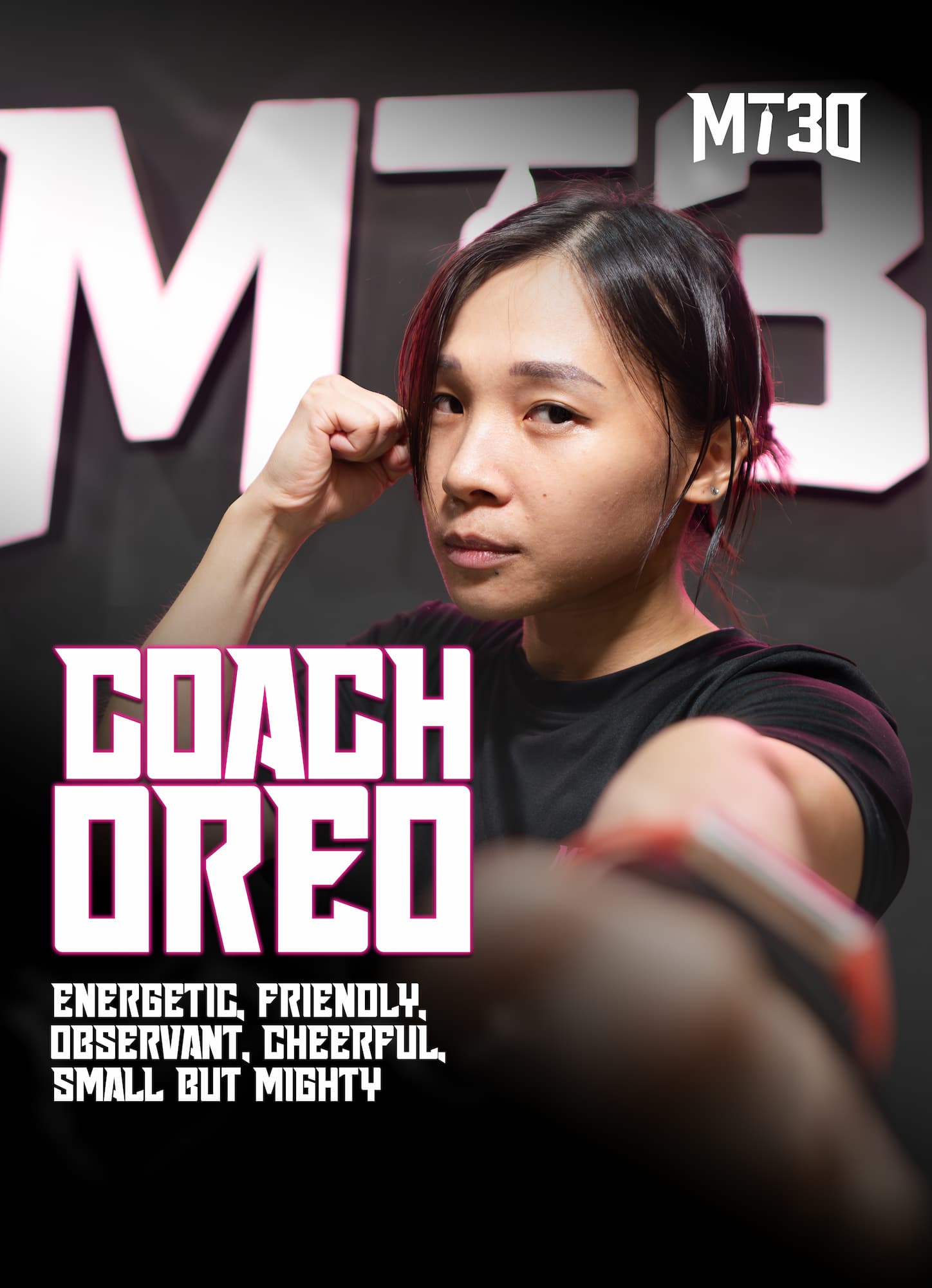 Oreo, MT30 trainer, throwing a punch towards the camera during a boxing pose